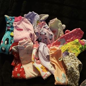 Lot of 13 pajamas all long sleeved feet in.